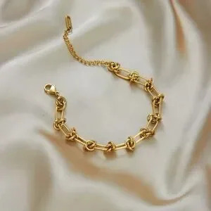 Graduated Link 18k Gold Stainless Steel Knot Bracelet Graduated Link 18k Gold Stainless Steel Knot Bracelet